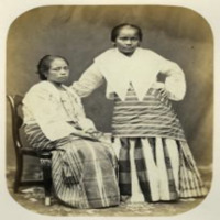Image of two Tagalog women wearing semi-traditional clothing 