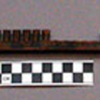 Comb, for loom, carved wood, tapered teeth, some broken or missing