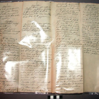 Label, paper, rectangular, ink inscription both sides, folded