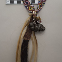 Bead necklace with hair pendants