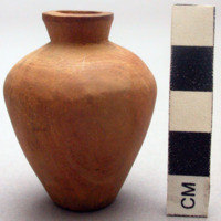 Small carved wooden bottle or jar without a stopper, plugged bottom. H: 5.5. cm