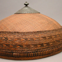 Basketry hat with metal top