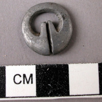 Lead ornament (ear or nose ring).