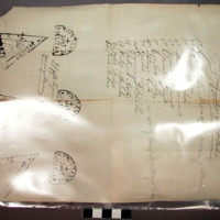 Label, paper, rectangular, stamped inscriptions at bottom, folded