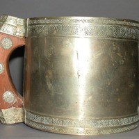 Large brass cup (measuring?) engraved upper and lower borders, with wood and bra