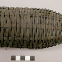 Basket-like object, use unknown, possibly a trap of some kind. Dark colored D: 7