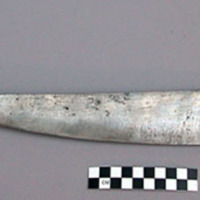 Kris - steel blade, single-edged, handle of carved dark brown wood; +