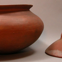 Covered redware vessels