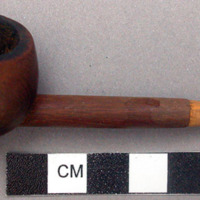 Carved wooden pipe with partially rotted stem, length: 9.3 cm.