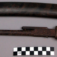 Flintlock gun in wood casing; Knife in wood sheath