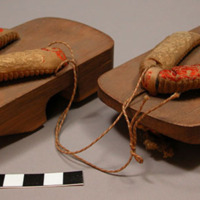 Pair of wooden Japanese shoes - footholds made of yellow and red silk