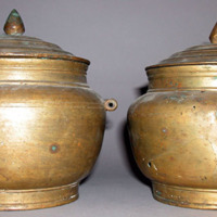 Covered brass jars