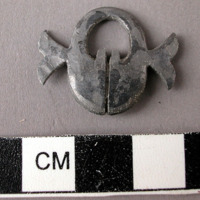 Lead ornament possibly from a necklace.