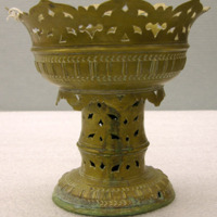 Footed brass pot